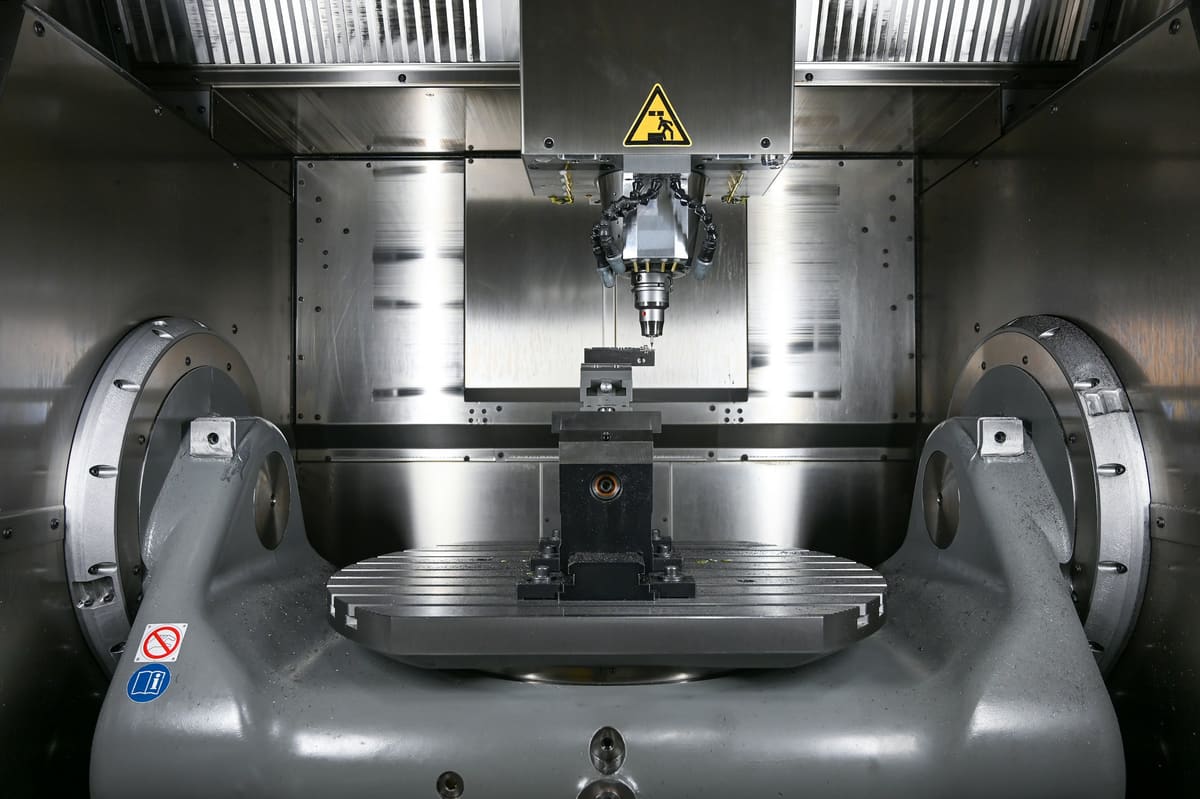 Machine tool structure and enclosure photographed in a clean engineering setting